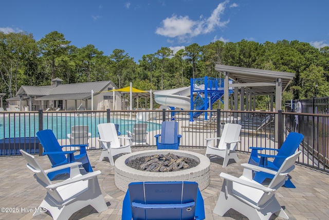 178 Pine View Blvd, Beaufort, NC 28516 - view of patio / terrace with a community pool, an outdoor fire pit, and fence