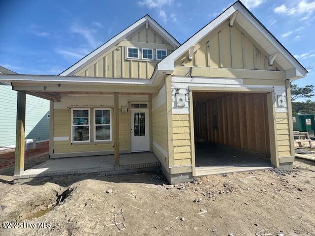 view of front facade featuring a porch and board and batten siding