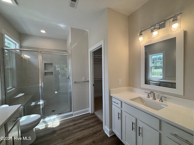 178 Pine View Blvd, Beaufort, NC 28516 - bathroom with vanity, toilet, a shower stall, wood finished floors, and visible vents