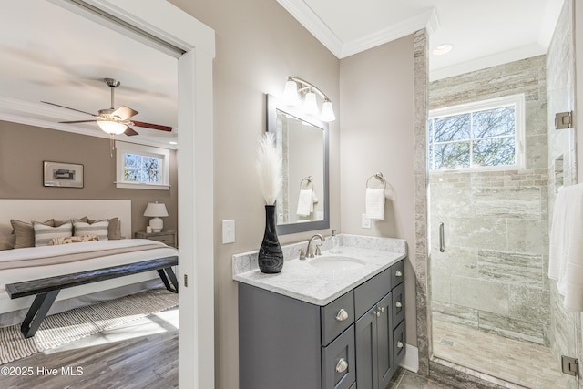 bathroom featuring ornamental molding, a shower stall, and a wealth of natural light