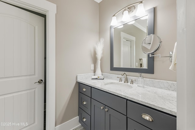 bathroom with baseboards and vanity