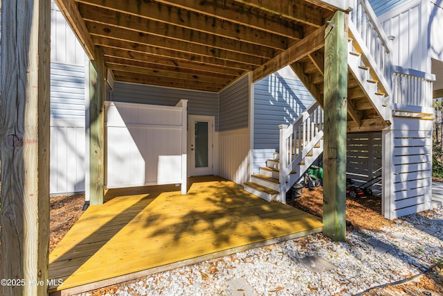 view of exterior entry featuring a deck