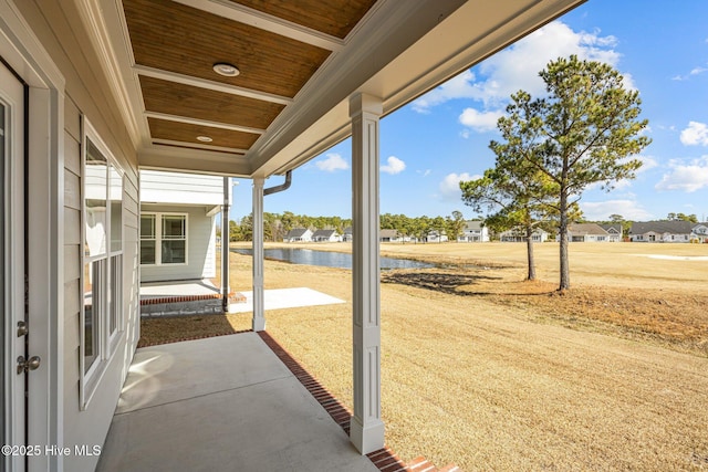 view of patio featuring a water view