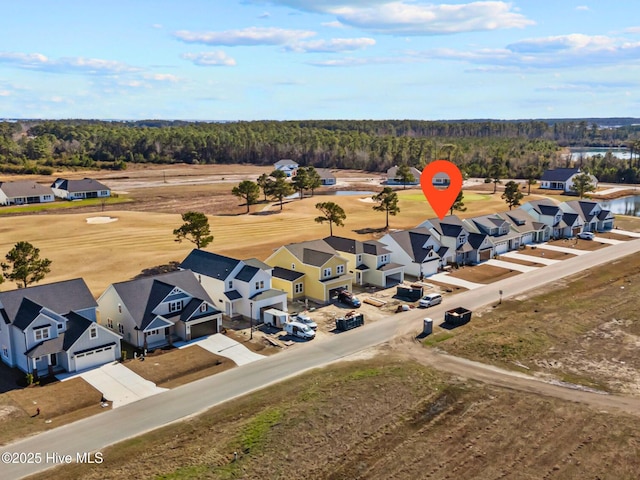 birds eye view of property featuring a residential view and a view of trees