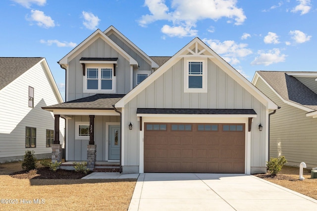 view of front of property featuring board and batten siding, concrete driveway, a shingled roof, and an attached garage