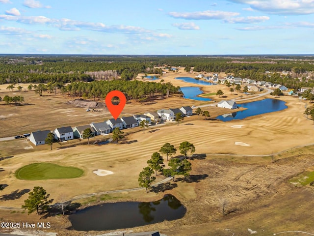 bird's eye view featuring a water view, view of golf course, and a wooded view