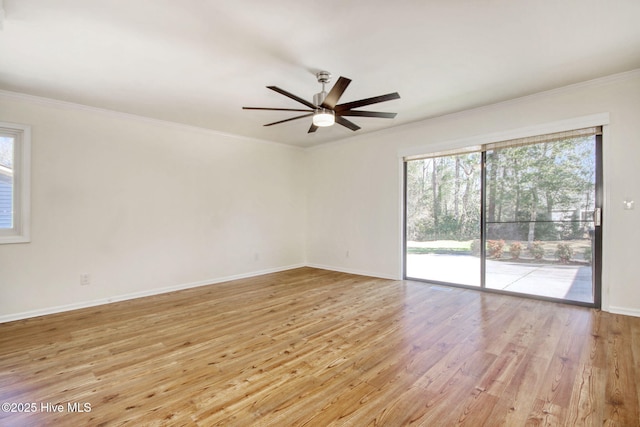 spare room with crown molding, ceiling fan, and light hardwood / wood-style floors