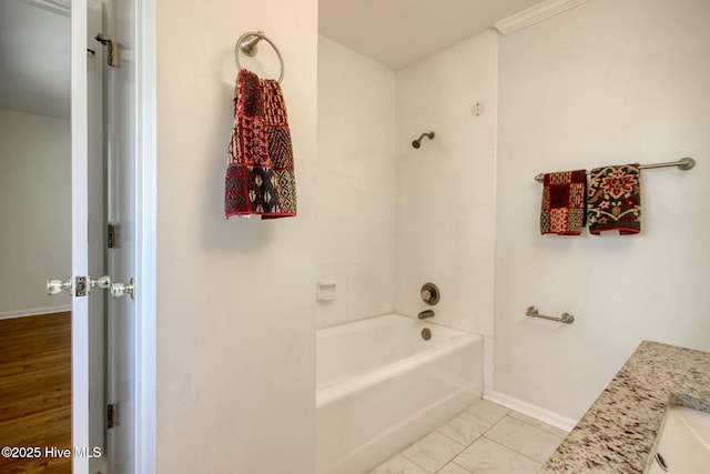 bathroom with vanity and tiled shower / bath combo