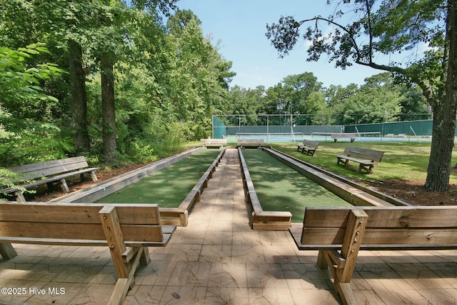 view of property's community with tennis court