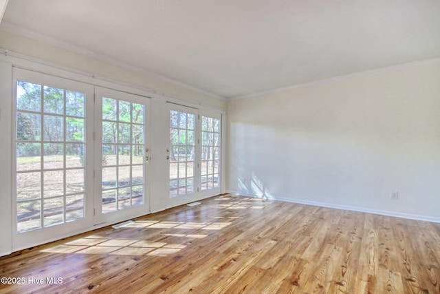 unfurnished room featuring crown molding and light hardwood / wood-style flooring