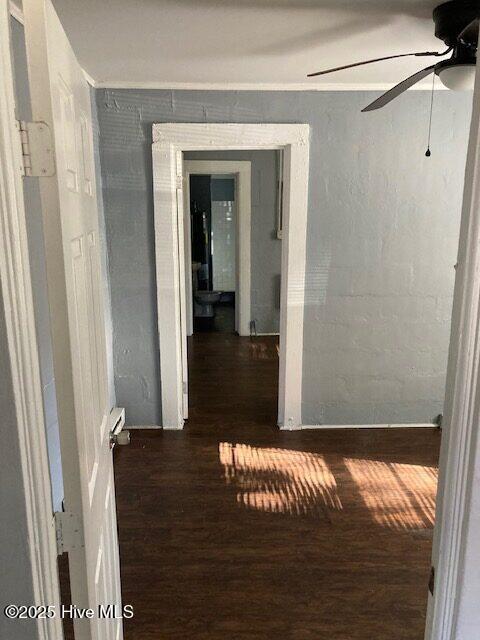 hallway featuring dark hardwood / wood-style floors