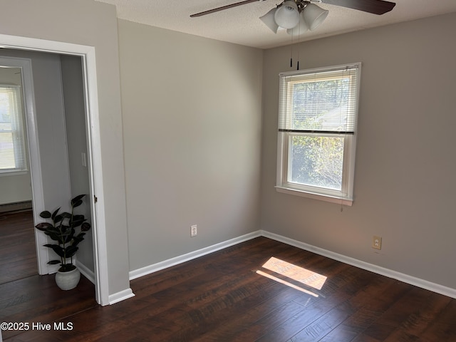 613 Sexton Ave, Zebulon, NC 27597 - spare room with a textured ceiling, baseboards, wood finished floors, and a ceiling fan