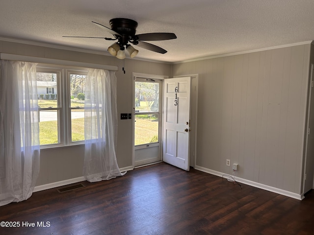 613 Sexton Ave, Zebulon, NC 27597 - interior space with a textured ceiling, dark wood-style floors, ceiling fan, and visible vents