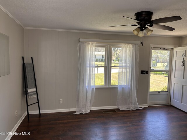 613 Sexton Ave, Zebulon, NC 27597 - foyer entrance featuring crown molding, a ceiling fan, a textured ceiling, visible vents, and dark wood-type flooring