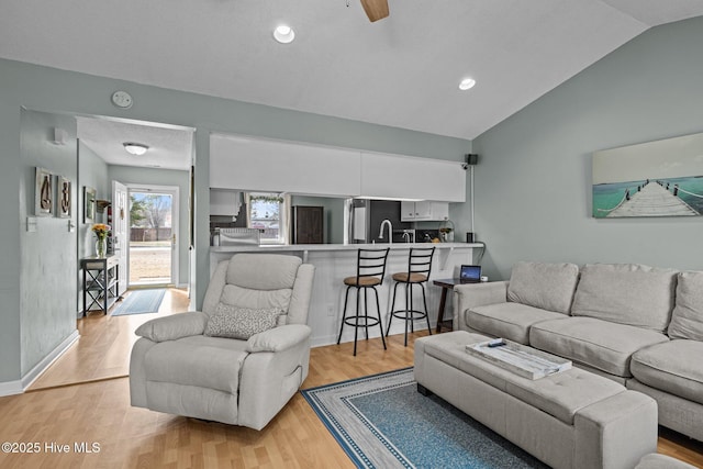 1810 Paulette Rd, Morehead City, NC 28557 - living area featuring vaulted ceiling, light wood-style flooring, and recessed lighting