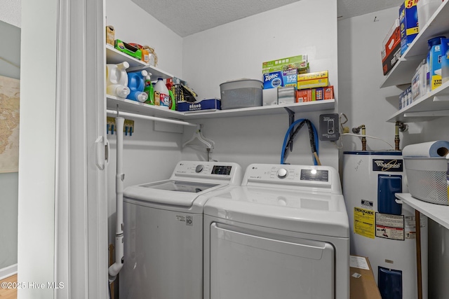 1810 Paulette Rd, Morehead City, NC 28557 - laundry area with water heater, washer and clothes dryer, and a textured ceiling