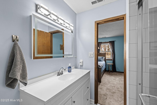 1810 Paulette Rd, Morehead City, NC 28557 - ensuite bathroom with a textured ceiling, vanity, and baseboards