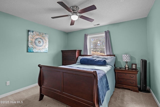1810 Paulette Rd, Morehead City, NC 28557 - bedroom featuring light carpet, baseboards, a ceiling fan, and a textured ceiling