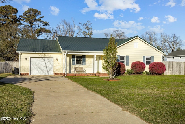 1810 Paulette Rd, Morehead City, NC 28557 - view of front of property featuring concrete driveway, an attached garage, and metal roof