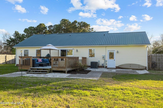 1810 Paulette Rd, Morehead City, NC 28557 - rear view of house with a wooden deck, metal roof, central AC, and outdoor lounge area