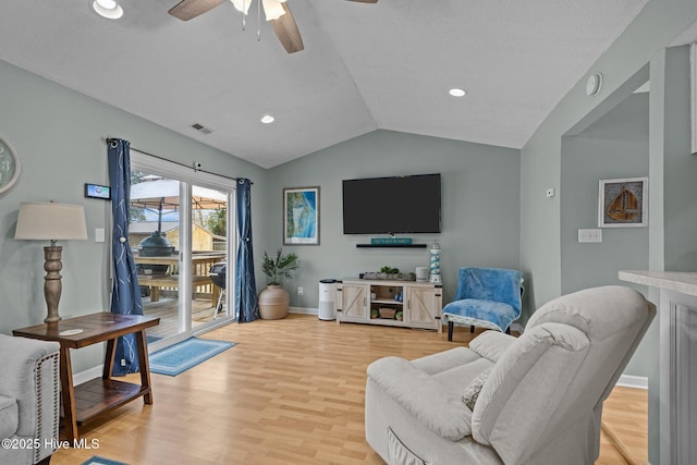 1810 Paulette Rd, Morehead City, NC 28557 - living room featuring light wood-style flooring, vaulted ceiling, ceiling fan, baseboards, and recessed lighting