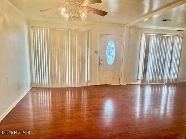 entrance foyer with hardwood / wood-style flooring, ceiling fan, and ornamental molding