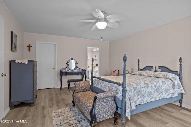 806 Lord Granville Dr, Morehead City, NC 28557 - bedroom featuring wood finished floors, ornamental molding, ceiling fan, baseboards, and ensuite bath