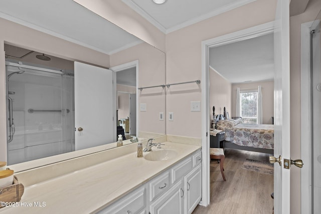 806 Lord Granville Dr, Morehead City, NC 28557 - ensuite bathroom featuring wood finished floors, ornamental molding, a shower, and vanity