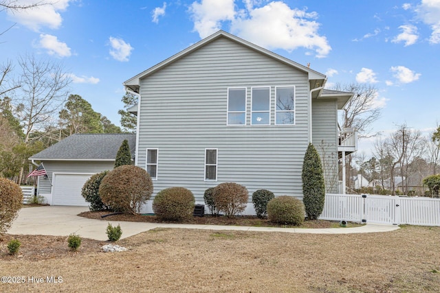 806 Lord Granville Dr, Morehead City, NC 28557 - view of home's exterior with a gate, a garage, fence, and concrete driveway