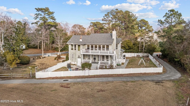 806 Lord Granville Dr, Morehead City, NC 28557 - view of front of property featuring a deck, a chimney, stairway, and view of scattered trees