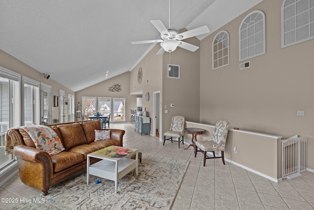 806 Lord Granville Dr, Morehead City, NC 28557 - living room with high vaulted ceiling, baseboards, a ceiling fan, and light tile patterned floors