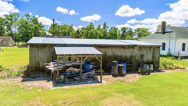 view of outbuilding with a lawn