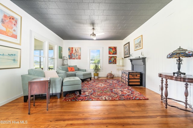 living room with hardwood / wood-style flooring and a wealth of natural light