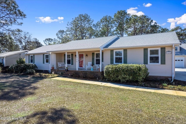 ranch-style home featuring a porch and a front lawn