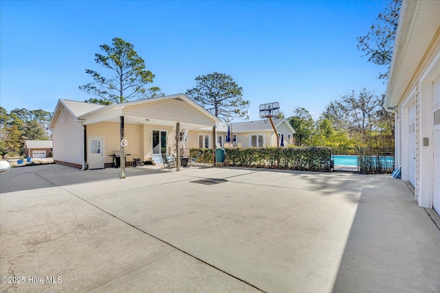 view of front of house featuring fence