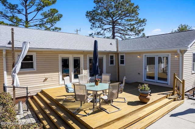 wooden deck with outdoor dining area