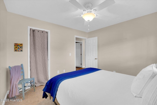 carpeted bedroom featuring a ceiling fan