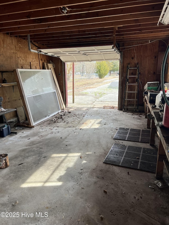 garage featuring wood walls