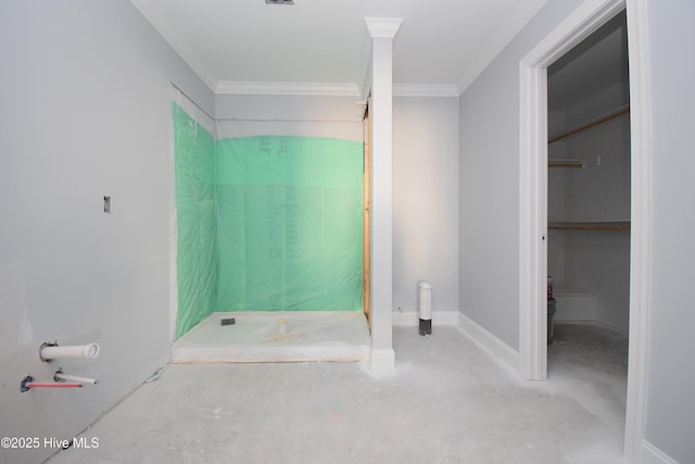 bathroom with crown molding and concrete flooring