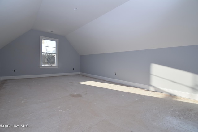 additional living space featuring vaulted ceiling