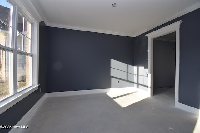 unfurnished room featuring crown molding, plenty of natural light, and concrete flooring