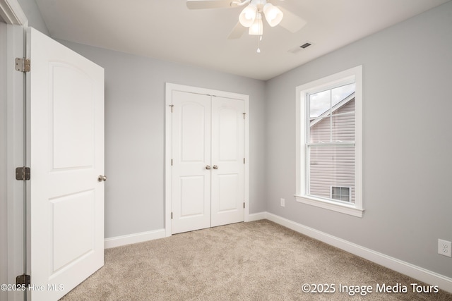 1200 Hunley Ct, Winterville, NC 28590 - unfurnished bedroom featuring a closet, visible vents, light colored carpet, and baseboards