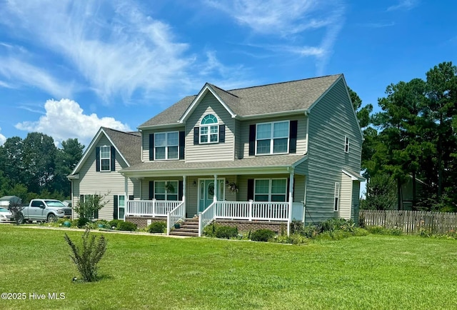 view of front of home featuring covered porch, roof with shingles, fence, and a front lawn