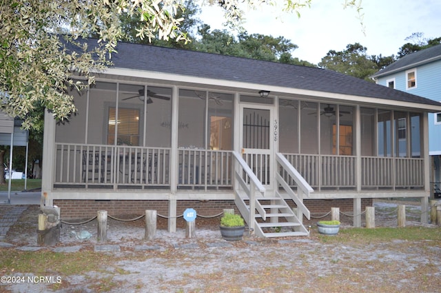 view of front of home with ceiling fan and a porch