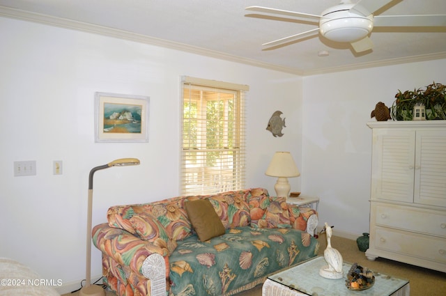 living room with crown molding, carpet flooring, and ceiling fan