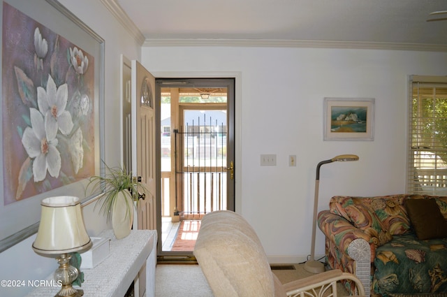 carpeted living room with crown molding