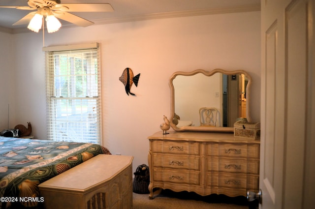 bedroom featuring ornamental molding and ceiling fan