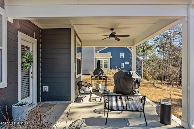 view of patio with ceiling fan and area for grilling