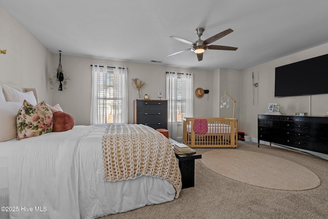 carpeted bedroom featuring ceiling fan