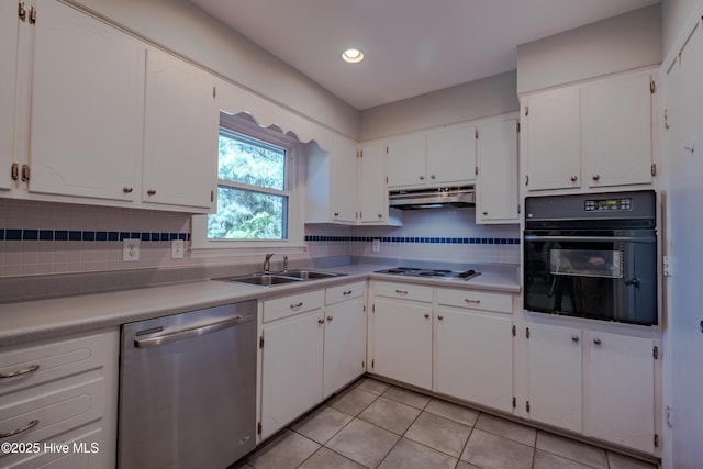 kitchen with white cabinetry, a sink, oven, under cabinet range hood, and stainless steel dishwasher